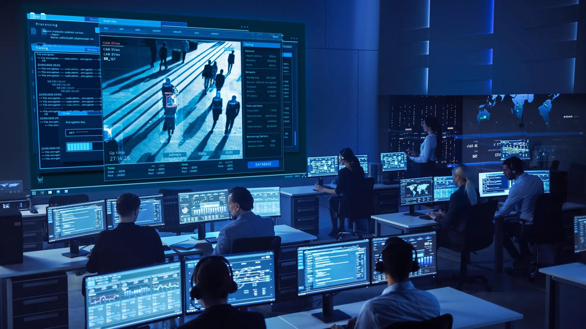 Security Operations Center with analysts monitoring dashboards